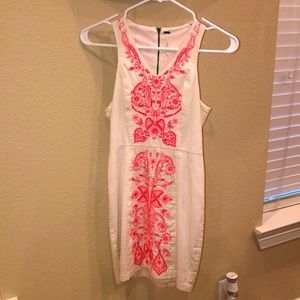 White dress with coral stitching